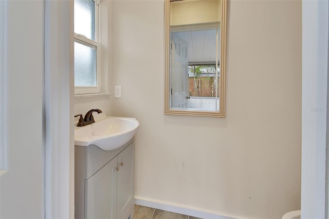 bathroom with vanity and tile patterned floors