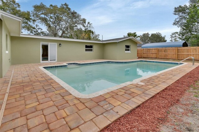 view of swimming pool with a patio