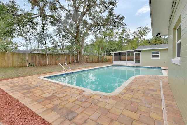 view of swimming pool featuring a patio area