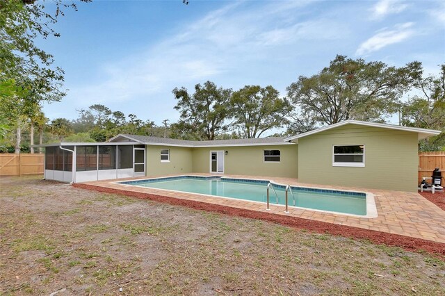 view of pool with a sunroom