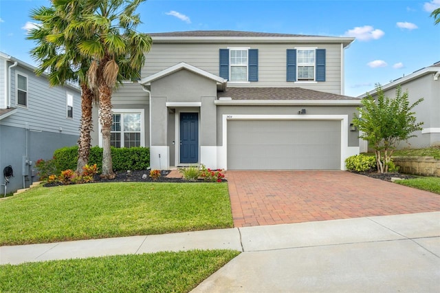 front facade with a front yard and a garage