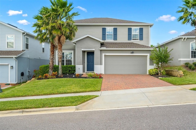 front of property with a front yard and a garage