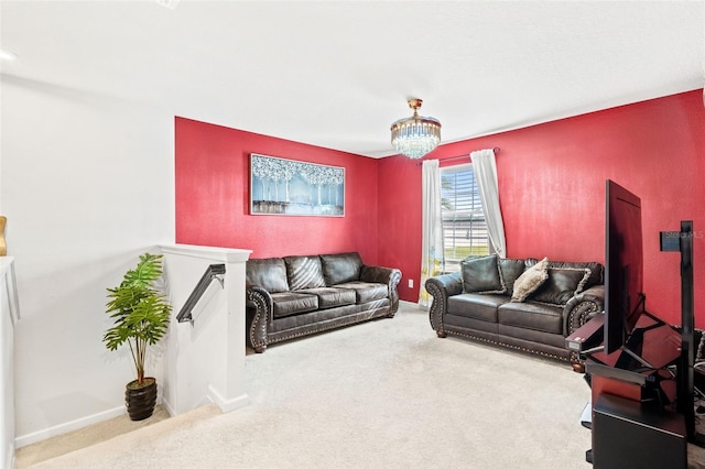 carpeted living room featuring an inviting chandelier