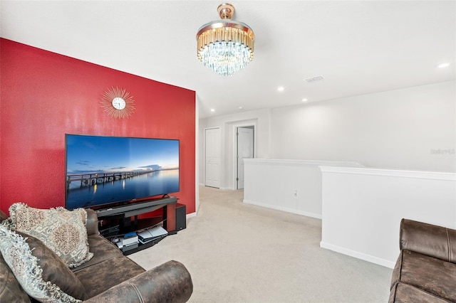 living room featuring light carpet and a chandelier