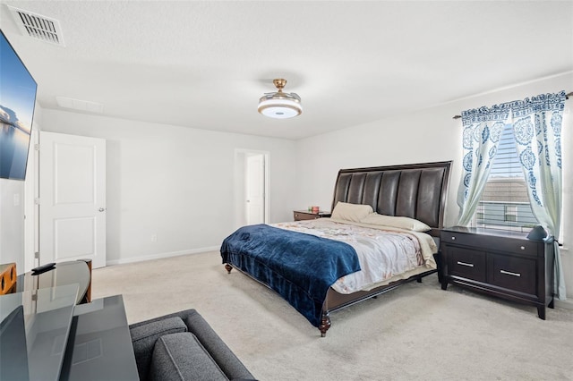 bedroom featuring light colored carpet