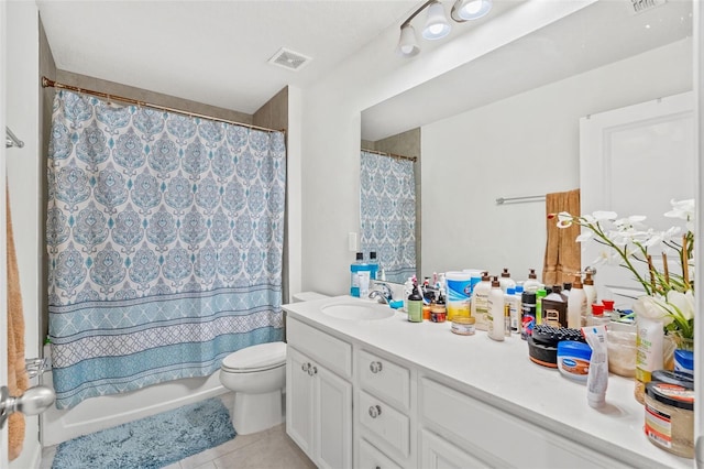 full bathroom featuring tile patterned flooring, vanity, toilet, and shower / bathtub combination with curtain