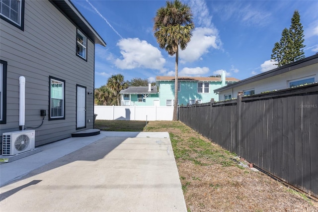 view of yard featuring a patio area and ac unit