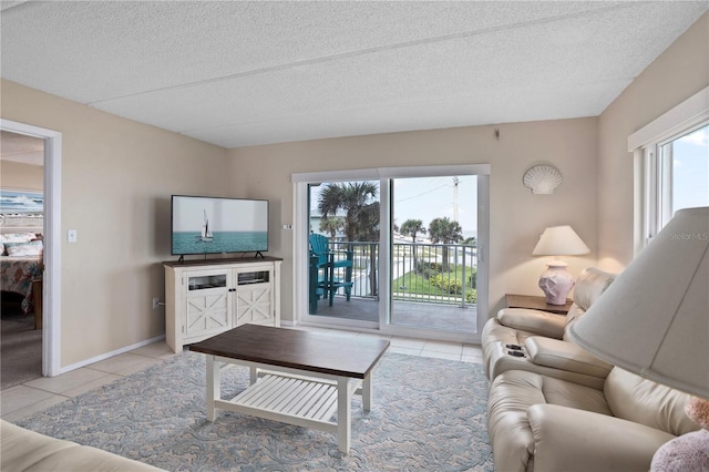 tiled living room featuring a textured ceiling