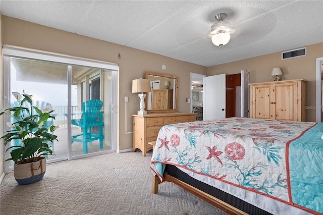 bedroom featuring carpet flooring, access to exterior, ceiling fan, and a textured ceiling