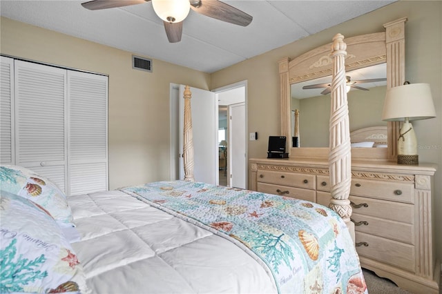 carpeted bedroom with a closet and ceiling fan