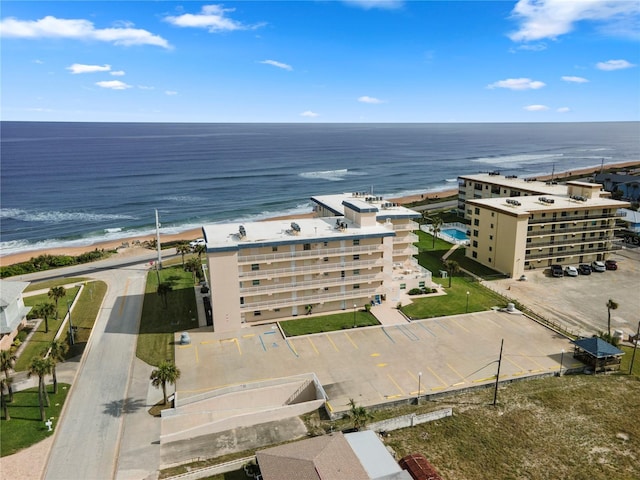 bird's eye view with a water view and a view of the beach