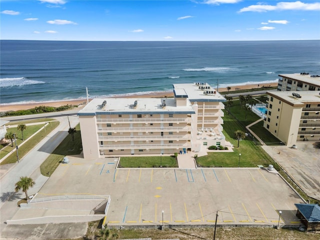 bird's eye view featuring a beach view and a water view