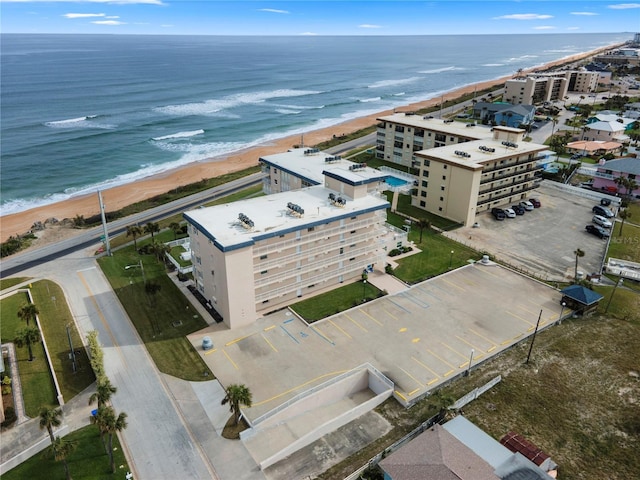 drone / aerial view with a view of the beach and a water view