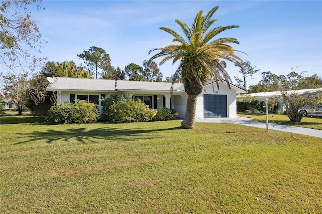 ranch-style home with driveway, a garage, and a front lawn