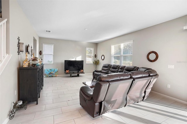 living room featuring light tile patterned flooring