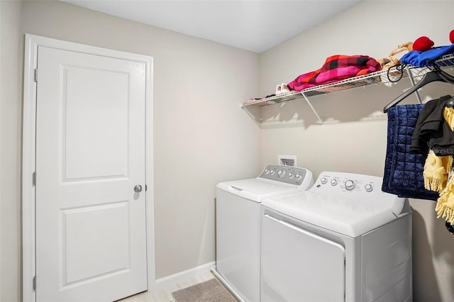 washroom with independent washer and dryer