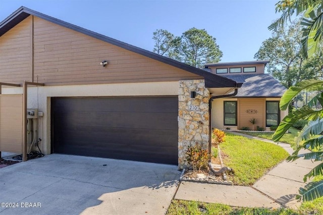 ranch-style home with a garage