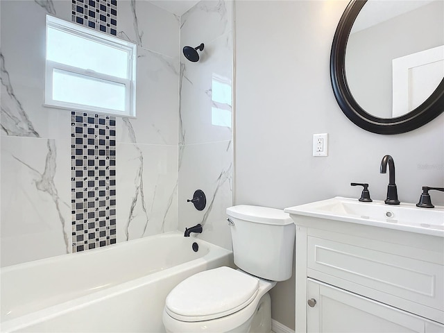 full bathroom with vanity, tiled shower / bath combo, and toilet