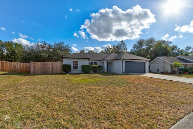 single story home with a front yard and a garage