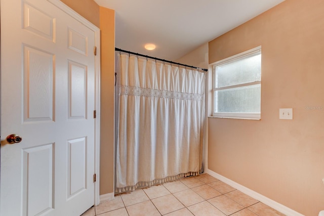 bathroom with tile patterned floors