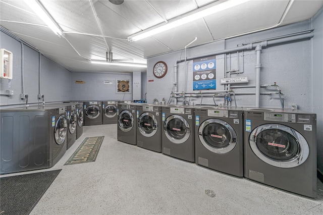 laundry area with independent washer and dryer