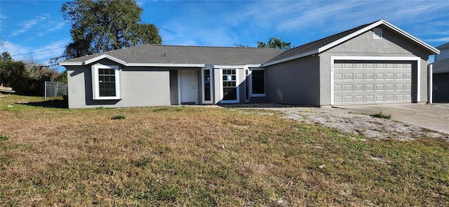 single story home featuring a garage and a front yard