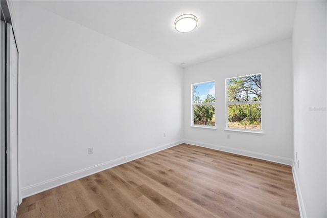 empty room with light hardwood / wood-style floors