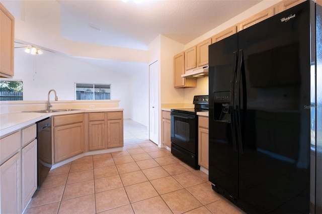 kitchen with light brown cabinets, light tile patterned floors, black appliances, and sink