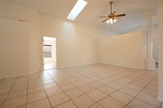 tiled empty room with high vaulted ceiling and ceiling fan