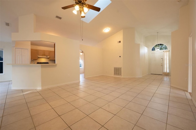 unfurnished room featuring light tile patterned floors, high vaulted ceiling, and ceiling fan