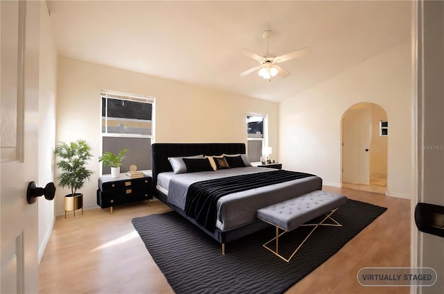 bedroom with ceiling fan and light wood-type flooring