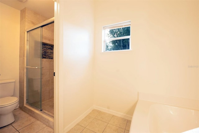 bathroom with tile patterned floors, independent shower and bath, and toilet