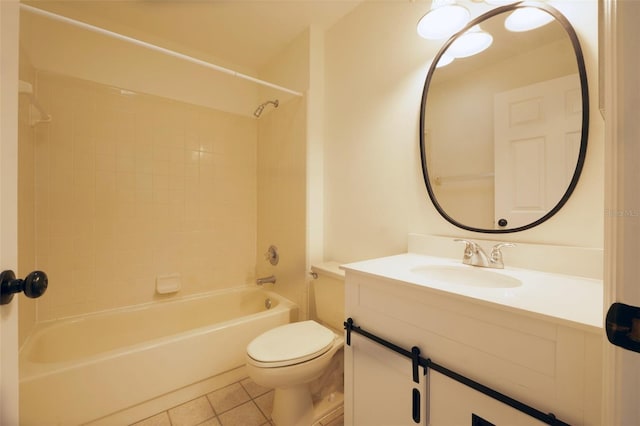 full bathroom with tile patterned floors, vanity, tiled shower / bath combo, and toilet