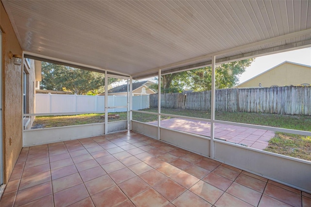 unfurnished sunroom featuring a wealth of natural light