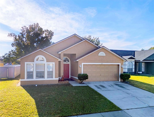 ranch-style home with a front lawn and a garage