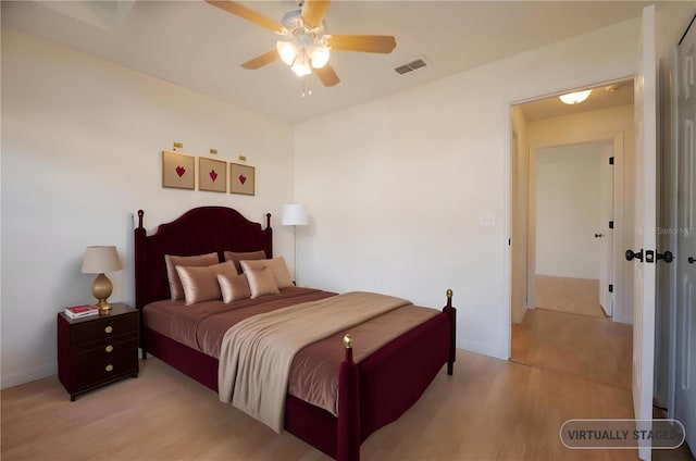 bedroom with ceiling fan and light hardwood / wood-style flooring