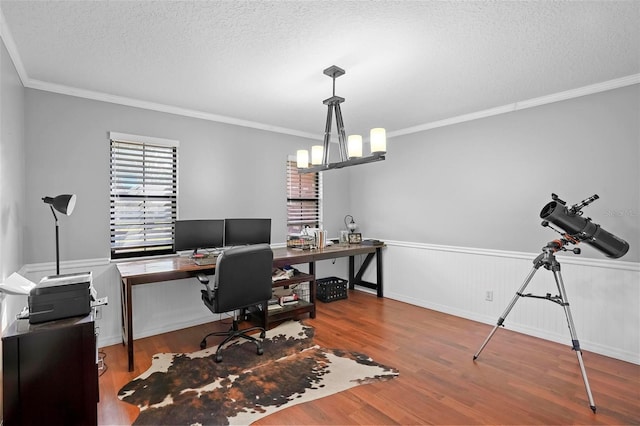 1195 Glen Royal Ter, Deland, FL 32720 - office area featuring a textured ceiling, wood finished floors, wainscoting, crown molding, and a chandelier