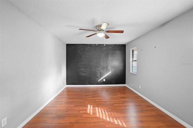 1195 Glen Royal Ter, Deland, FL 32720 - empty room featuring a ceiling fan, wood finished floors, baseboards, and a textured ceiling