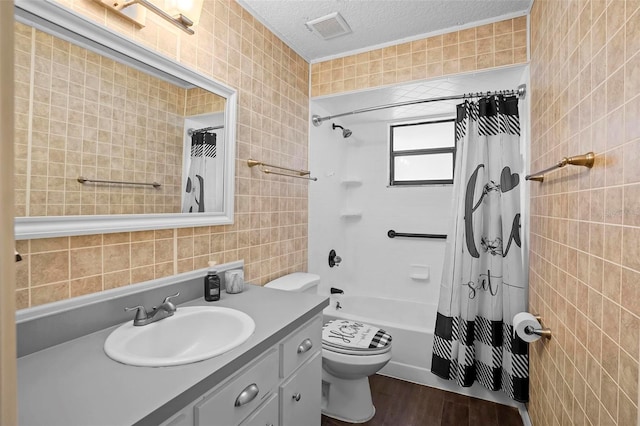 1195 Glen Royal Ter, Deland, FL 32720 - full bathroom with tile walls, vanity, wood finished floors, toilet, and shower / bath combination with curtain