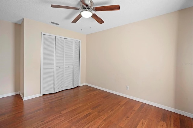 1195 Glen Royal Ter, Deland, FL 32720 - unfurnished bedroom featuring a closet, wood finished floors, baseboards, and a ceiling fan