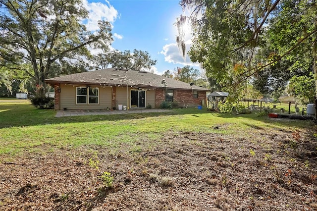 1195 Glen Royal Ter, Deland, FL 32720 - rear view of property with a patio area and a yard