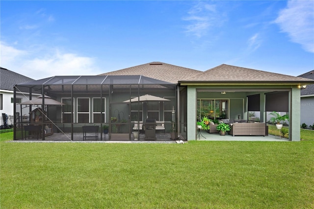 back of property featuring a lawn, glass enclosure, a patio area, and outdoor lounge area