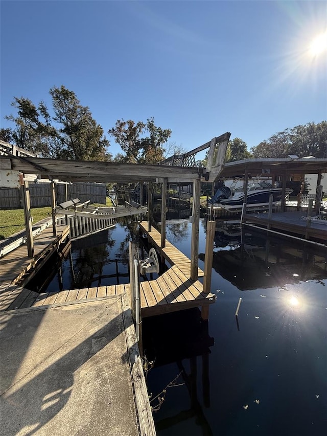 dock area with a water view