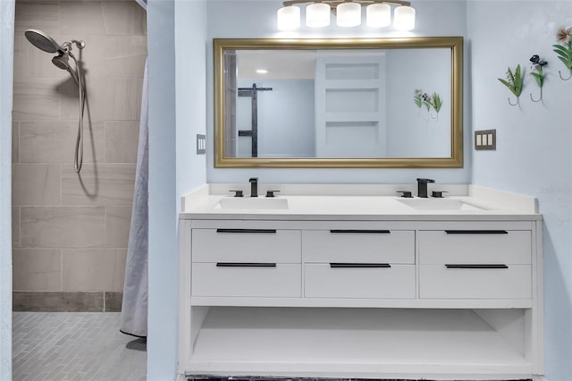 bathroom featuring vanity and a tile shower