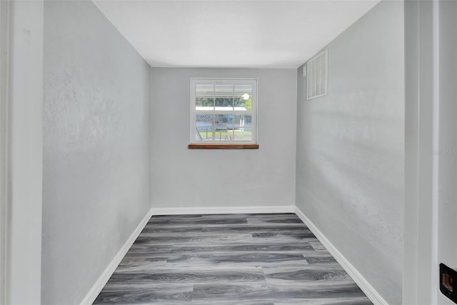 unfurnished room featuring hardwood / wood-style floors