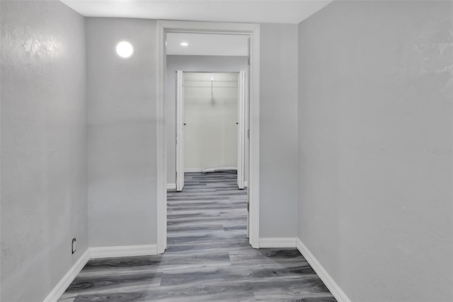 hallway with dark wood-type flooring