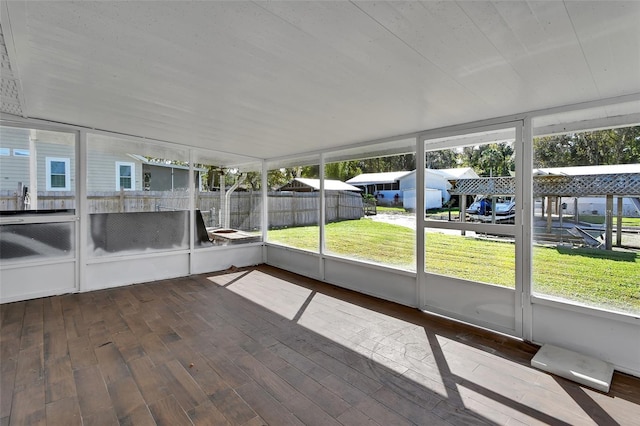 unfurnished sunroom with a wealth of natural light