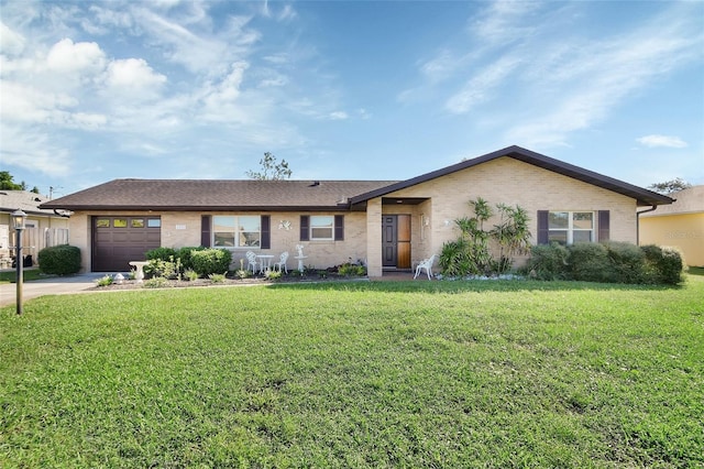 ranch-style home featuring a front yard and a garage