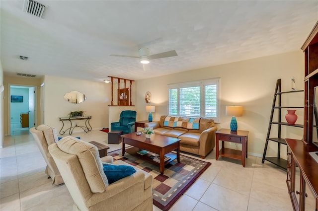 tiled living room featuring ceiling fan