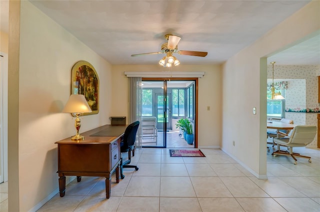 tiled office space with ceiling fan